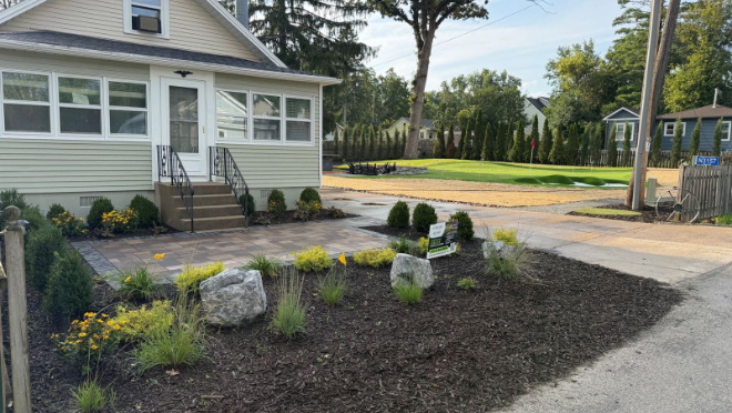 New front walkway pavers and plantings at a finished project